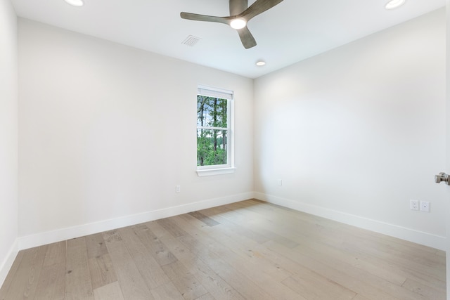 unfurnished room featuring ceiling fan and light hardwood / wood-style flooring