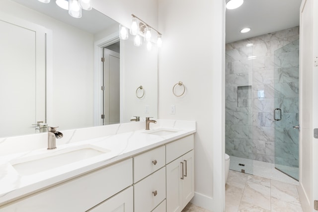 bathroom with toilet, walk in shower, and vanity