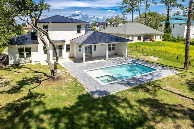 back of property featuring a patio, a fenced in pool, and a yard