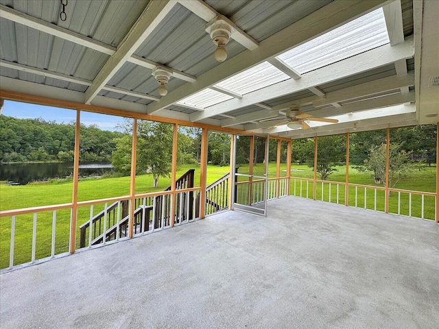 view of patio / terrace with a water view and ceiling fan