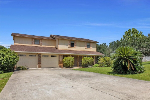 view of front of home featuring a garage and a front yard