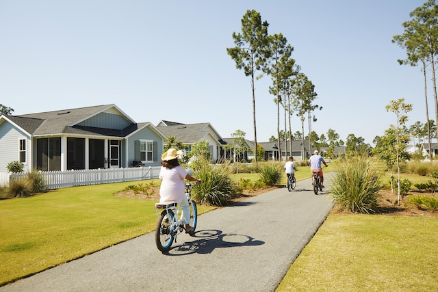 view of property's community with a yard