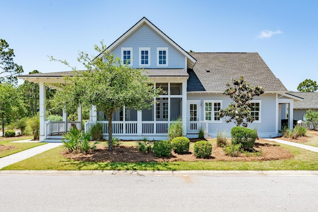 view of front of home featuring a sunroom