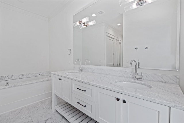 bathroom with vanity, a bath, and crown molding