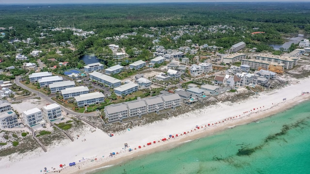 aerial view featuring a view of the beach and a water view