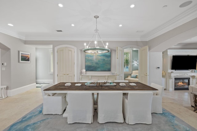 interior space with decorative light fixtures, arched walkways, crown molding, and recessed lighting