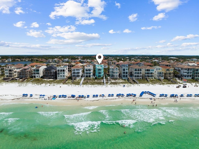 bird's eye view featuring a residential view, a water view, and a beach view