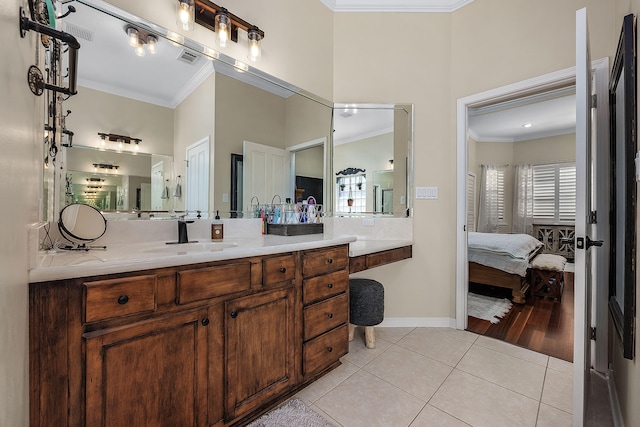 bathroom featuring vanity, tile floors, and ornamental molding