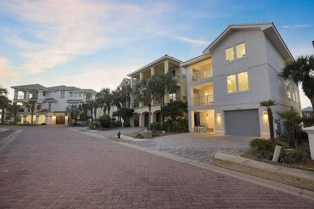 exterior space featuring a garage and a balcony