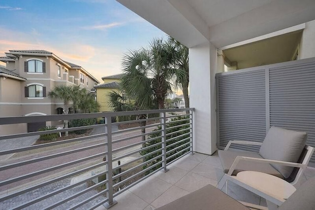 view of balcony at dusk