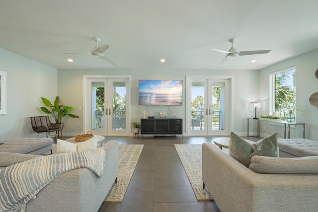 living room with a healthy amount of sunlight, ceiling fan, and french doors