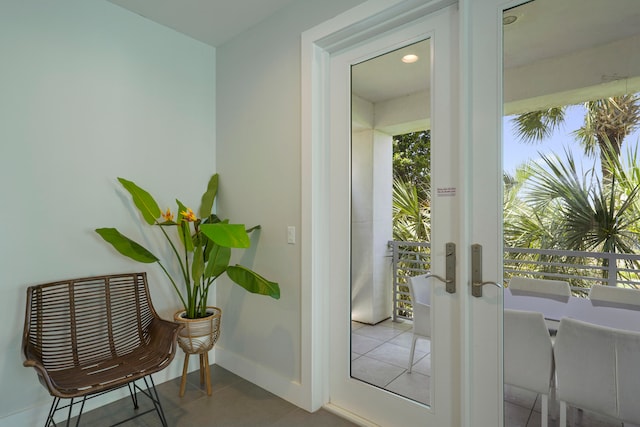 entryway with tile flooring and french doors