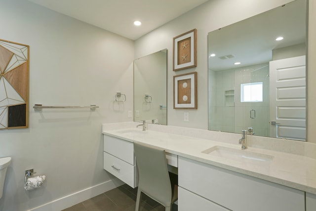 bathroom featuring tile floors, toilet, double sink, and oversized vanity