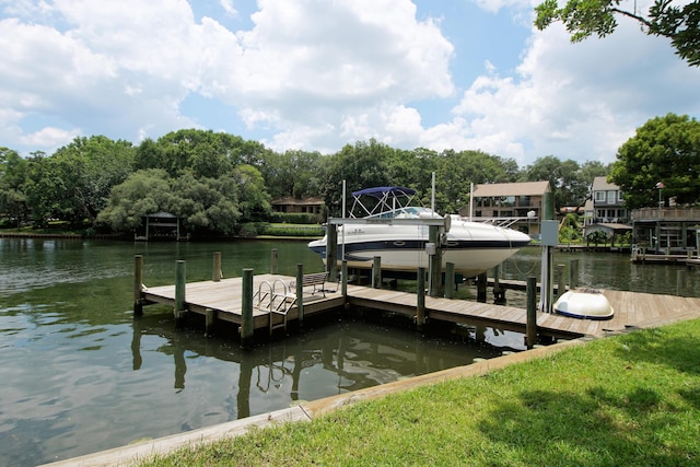 dock area with a water view and boat lift