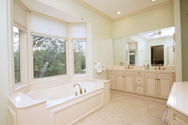 full bath featuring a garden tub, a sink, a ceiling fan, double vanity, and crown molding