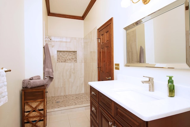 bathroom with tile patterned floors, walk in shower, vanity, and crown molding