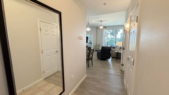 hallway featuring light tile flooring