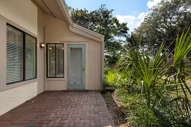 doorway to property with a patio