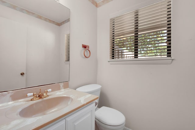 bathroom featuring vanity and toilet