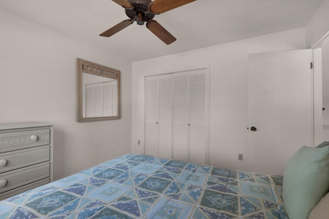 tiled bedroom with a closet and ceiling fan