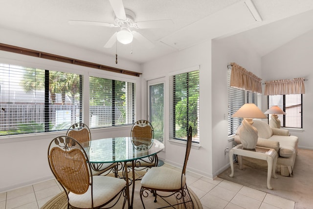 tiled dining area featuring ceiling fan and a wealth of natural light