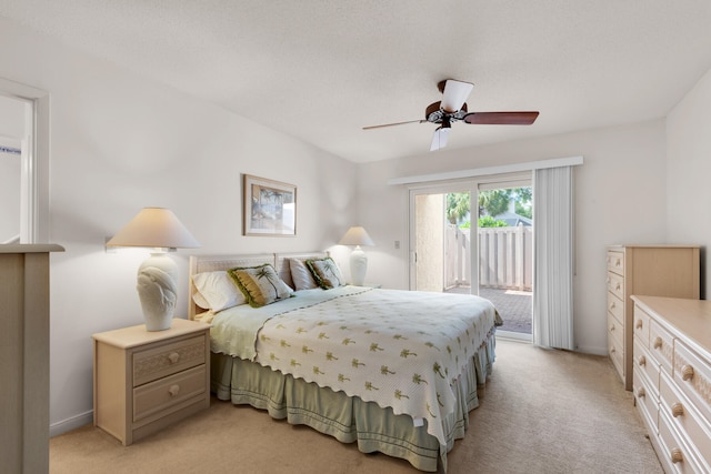 carpeted bedroom with access to outside and ceiling fan