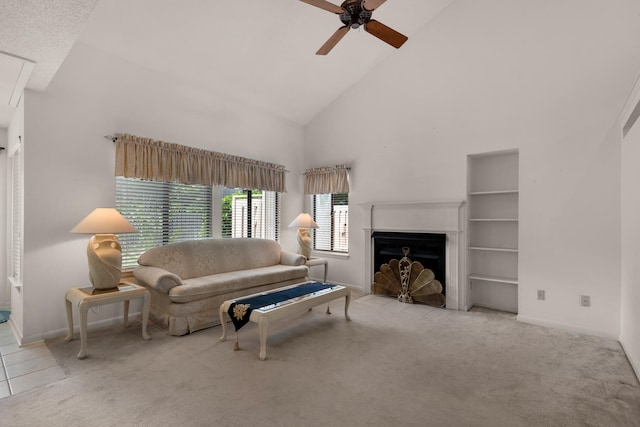 living room featuring high vaulted ceiling, ceiling fan, built in features, and light carpet