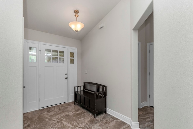 foyer entrance with lofted ceiling