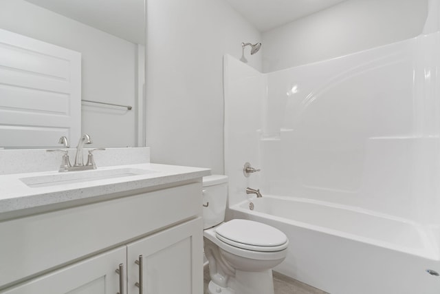 full bathroom with vanity, bathing tub / shower combination, and toilet