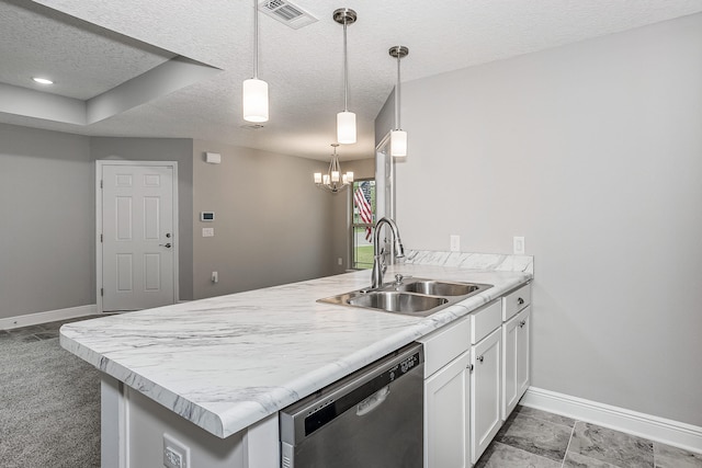 kitchen featuring hanging light fixtures, kitchen peninsula, sink, stainless steel dishwasher, and white cabinets