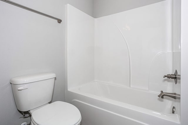 bathroom featuring toilet and shower / bathing tub combination