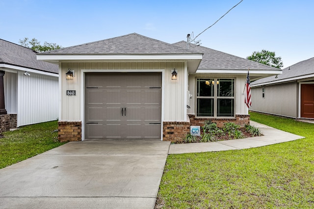 ranch-style house featuring a front yard and a garage