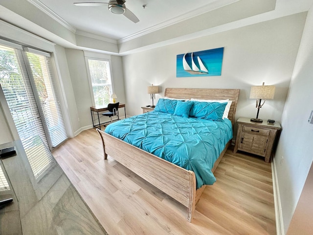 bedroom with ceiling fan, wood-type flooring, and crown molding