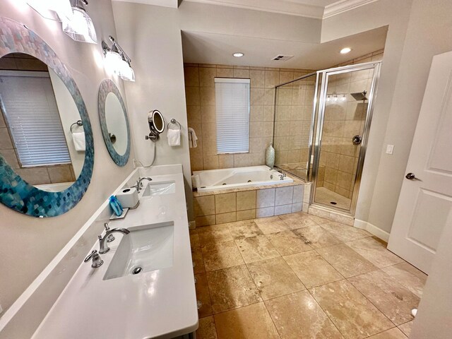 bathroom featuring vanity, crown molding, and independent shower and bath