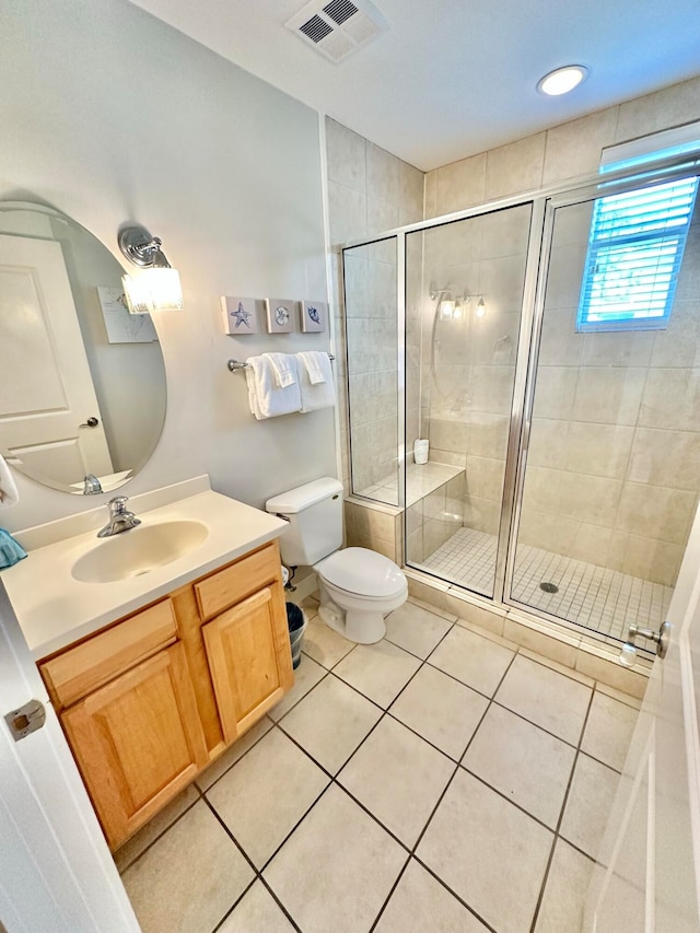 bathroom with walk in shower, tile patterned flooring, vanity, and toilet