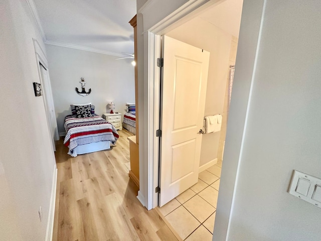 interior space featuring ornamental molding and light wood-type flooring