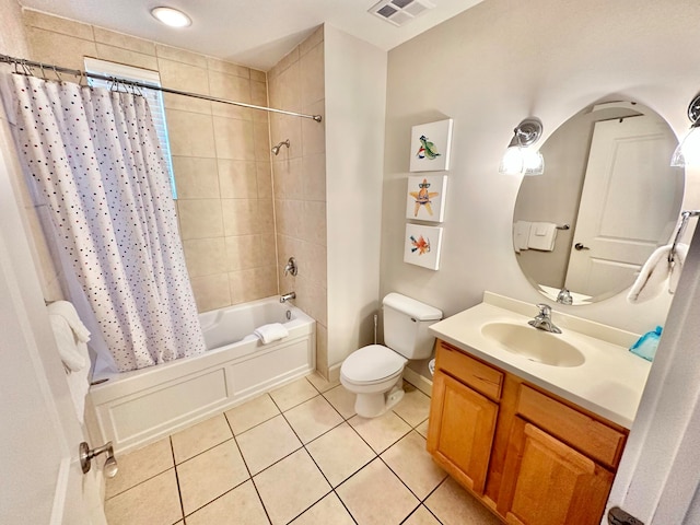 full bathroom featuring toilet, shower / bath combo, vanity, and tile patterned flooring