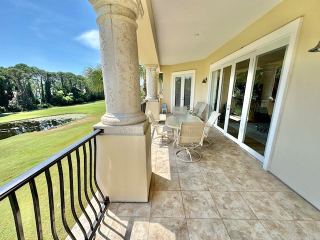 exterior space featuring a water view and french doors