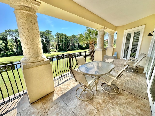 balcony featuring a water view