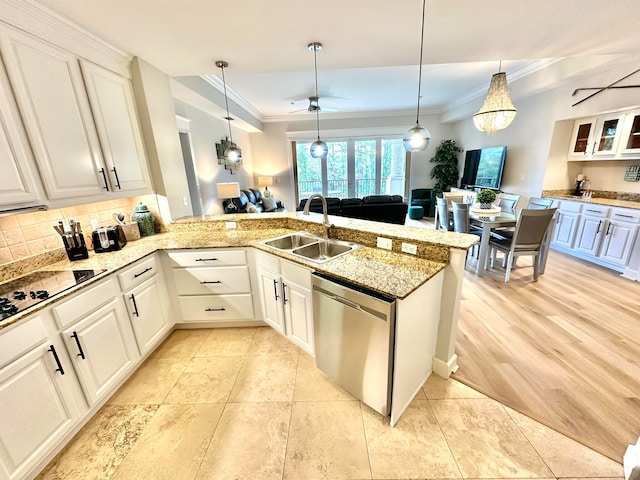 kitchen with stainless steel dishwasher, white cabinets, sink, and kitchen peninsula