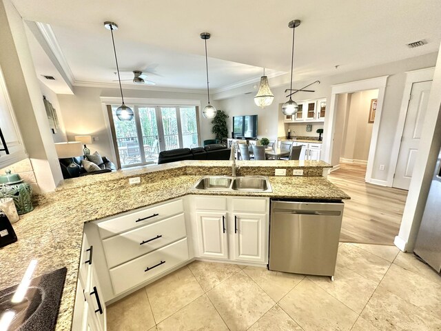 5377 Pine Ridge Ln Unit 5377, Miramar Beach, FL 32550 - kitchen with stainless steel dishwasher, a sink, open floor plan, ornamental molding, and white cabinets