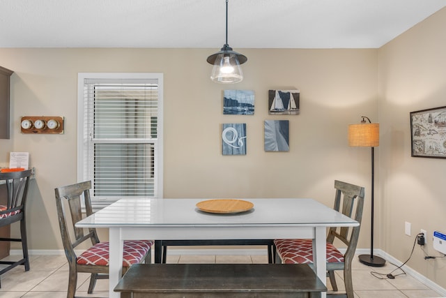 dining area with light tile flooring