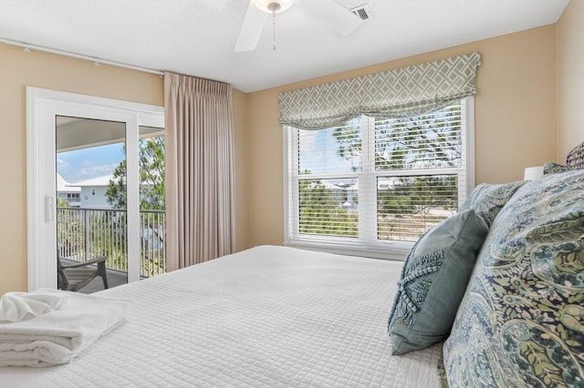 bedroom with ceiling fan and access to outside