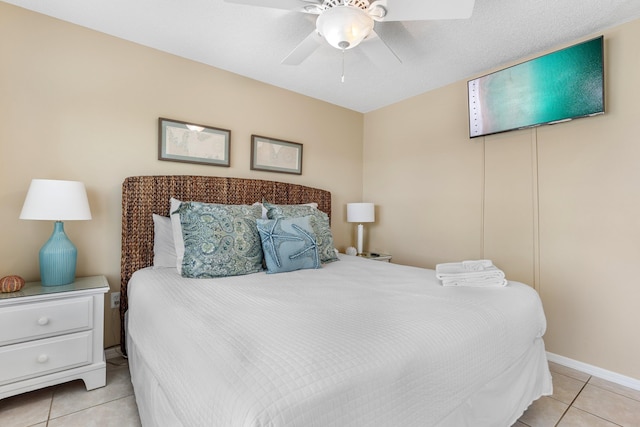 tiled bedroom featuring ceiling fan