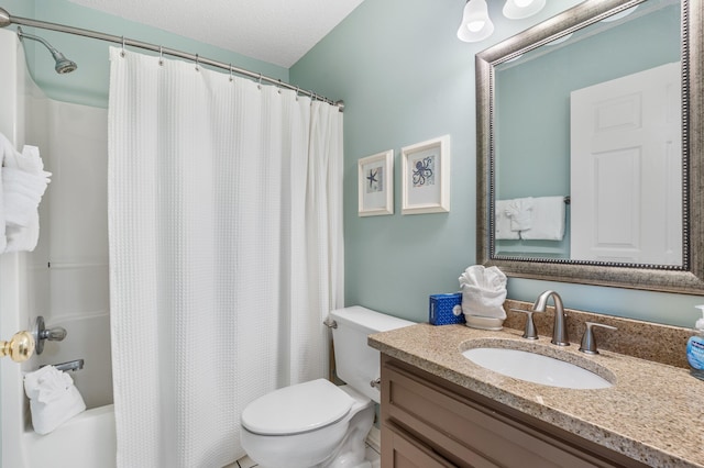 full bathroom featuring a textured ceiling, shower / bath combination with curtain, toilet, and vanity with extensive cabinet space