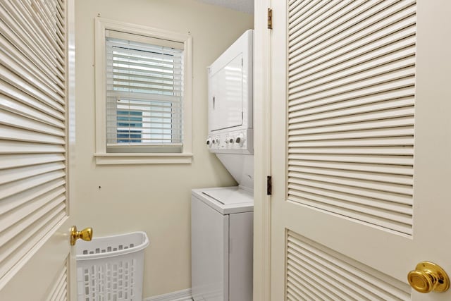 washroom with stacked washer / dryer