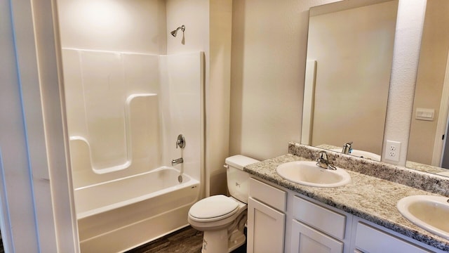 full bathroom with shower / bathing tub combination, hardwood / wood-style floors, vanity, and toilet