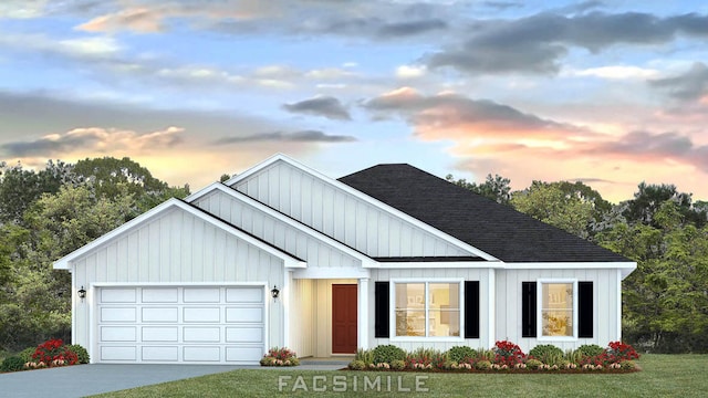 view of front facade with a lawn and a garage