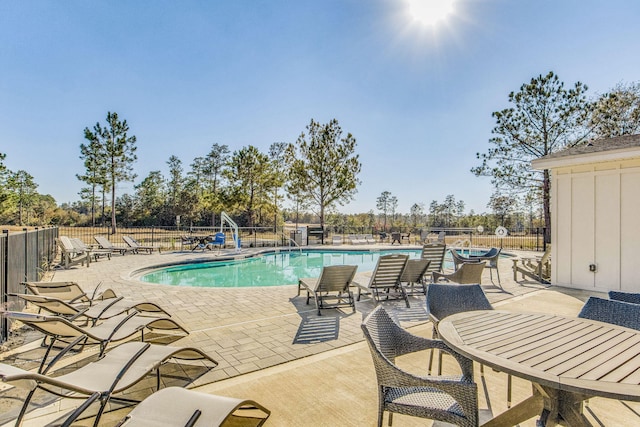 view of swimming pool with a patio