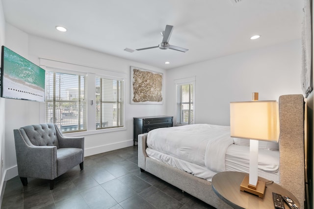 bedroom with dark tile flooring and ceiling fan